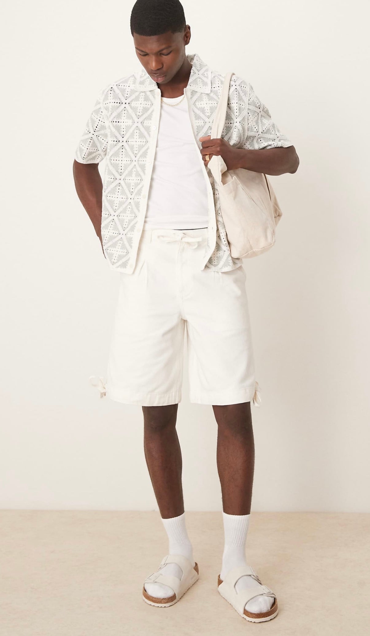 ASOS DESIGN longer length shorts with pleat detailing in ecru