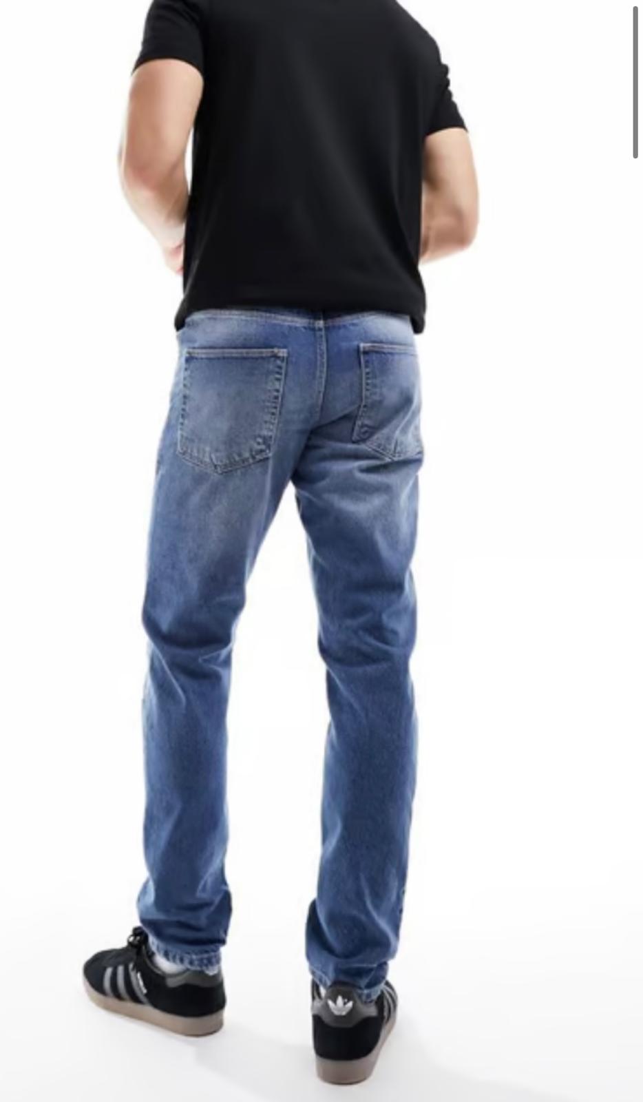 ASOS DESIGN slim jeans with rips in mid wash blue