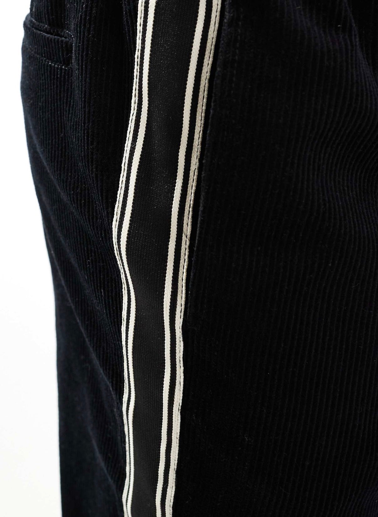 ASOS DESIGN baggy cord trousers with side taping in black