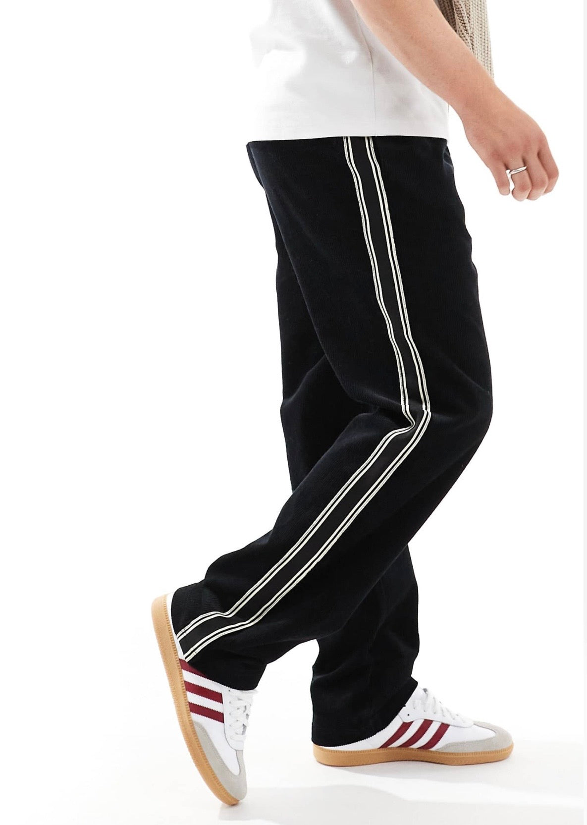 ASOS DESIGN baggy cord trousers with side taping in black