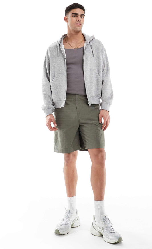 ASOS DESIGN long length textured shorts with workwear patch in green