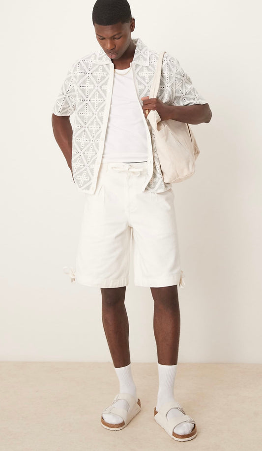 ASOS DESIGN longer length shorts with pleat detailing in ecru