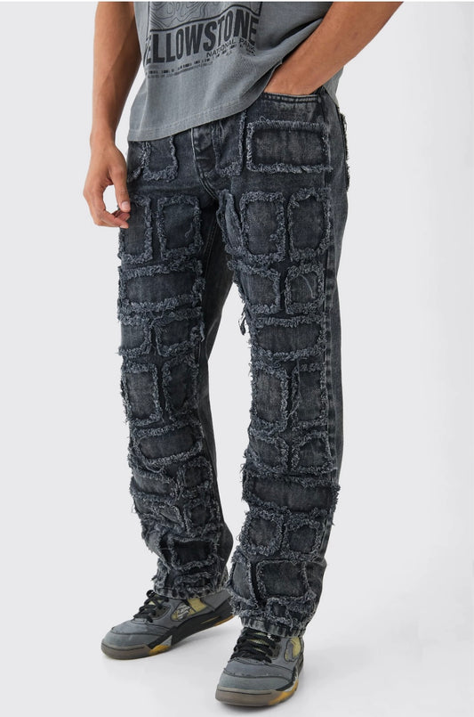 BOOHOOMAN RELAXED RIGID DISTRESSED PATCHWORK JEANS IN WASHED BLACK