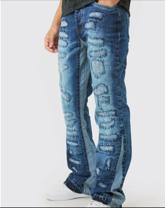 BoohooMan Slim Flare Rigid All Over Rip & Repaired Jeans In Indigo